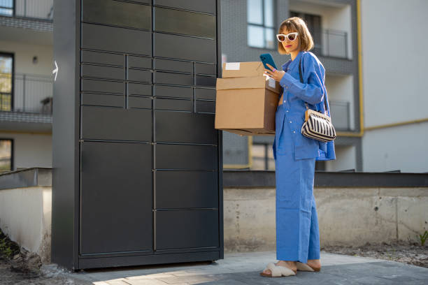 istock Woman picks up parcels from automatic post office near her home 1504458926