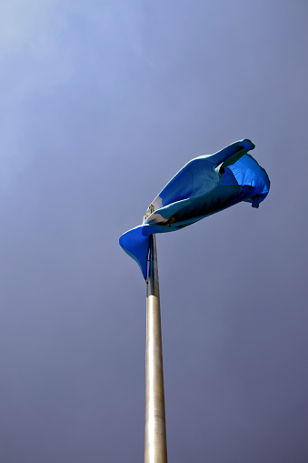flag pole and coat of arms embodied as a symbol of patriotism and nationality in Guatemala