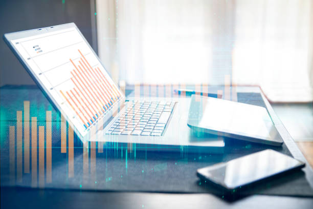 Abstract creative financial graph on laptop  and digital devices. Double exposure background