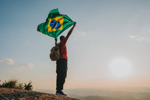 istock Man holding the flag of Brazil 1504472968