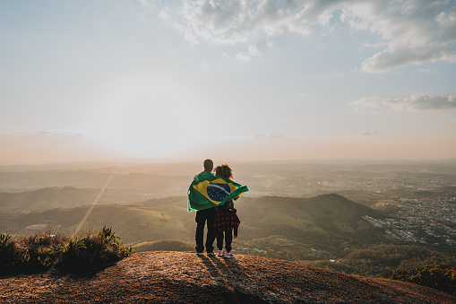 Couple with the flag of Brazil