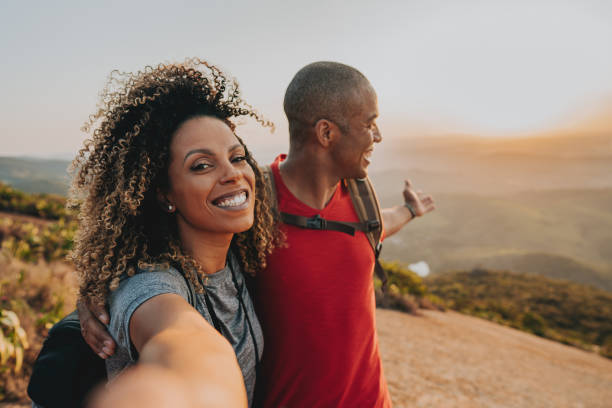 Couple walking on mountain trail