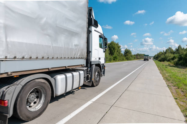 istock Truck on highway at sunny day 1504473225