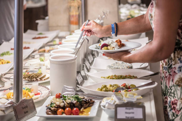 istock Woman selfserving on  at a banquet 1504493333