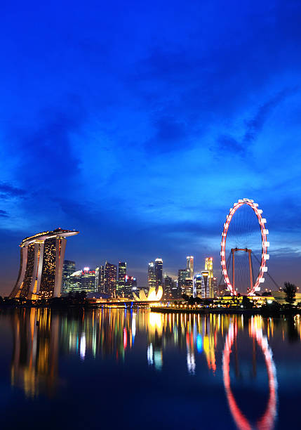 Singapore city skyline at night Singapore city skyline at night singapore city stock pictures, royalty-free photos & images
