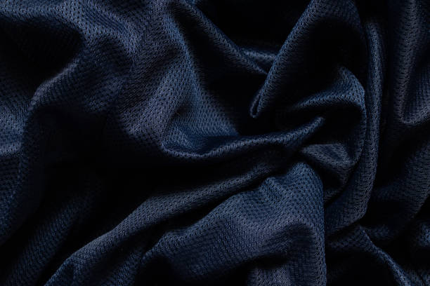 istock dark blue fabric wrinkled as background close up 1504518123