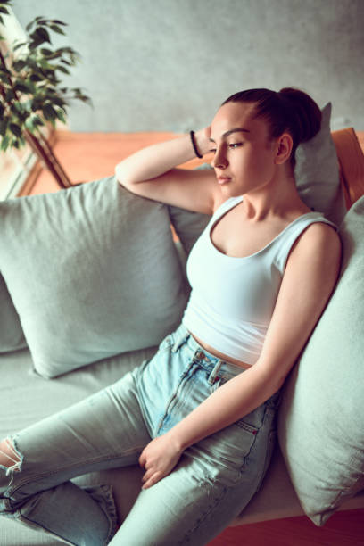 istock Beautiful Female Day Dreaming At Home 1504529719