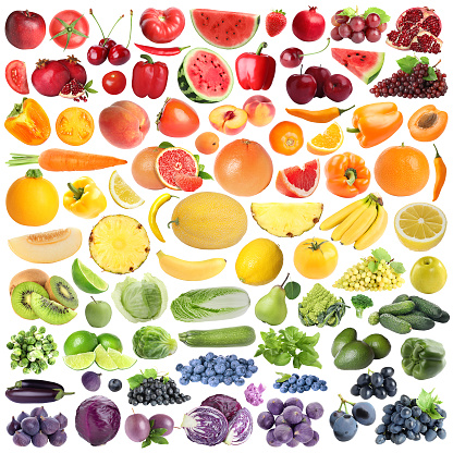 Many fresh fruits and vegetables arranged in rainbow colors on white background, collage