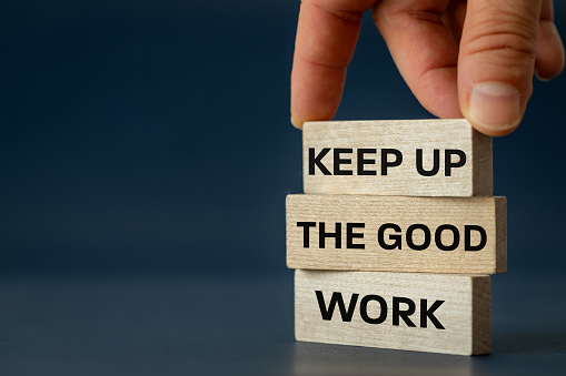 Keep up the good work, text is written on wooden blocks, Business concept, Motivating slogan, work commitment, copy space