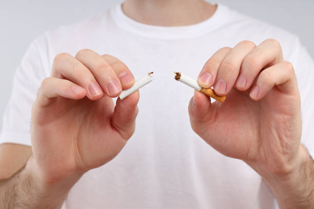 istock Man in white t-shirt break a cigarette 1504546156