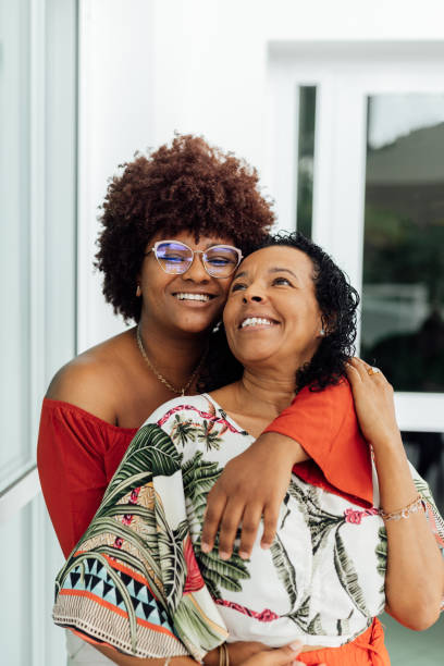 istock Lesbian couple hugging at home 1504549470