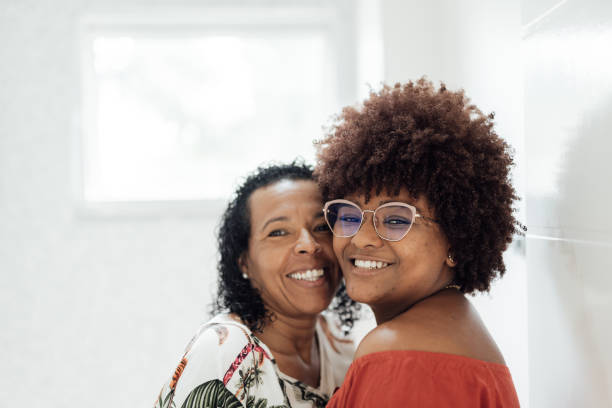 istock Smiling lesbian couple at home 1504551105