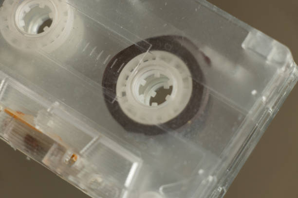 istock Old music cassette lies on a mirror close-up 1504553326