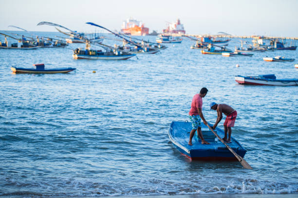 Fishermen on Rafts. Jangada refers, among other meanings, to a wooden vessel used by artisanal fishermen in the Northeast Region of Brazil. \nFORTALEZA, BRAZIL - Novembro 10, 2021