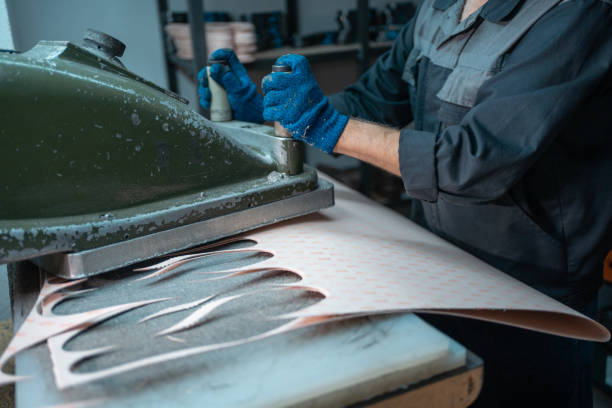istock people working with press machinery for cutting shoe leather 1504558390