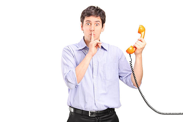 istock Man holding a telephone and gesturing silence 150468225