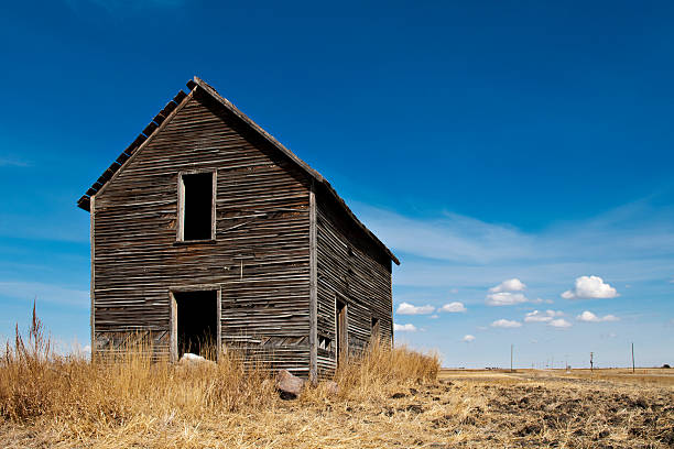 istock Old Two Storey Farm House on Prairies Abandoned 150468422