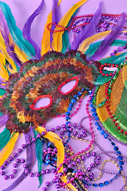 istock Mardi Gras still life feathered mask shiny party hat beads 150468633