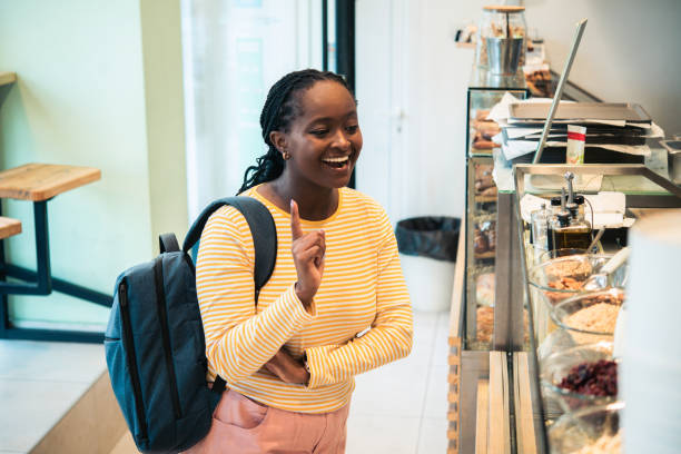 istock Young woman at the bakery 1504726066
