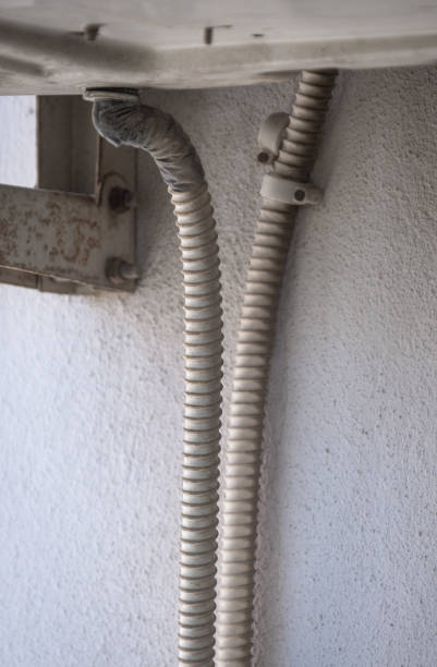 istock dirty and weathered air conditioner water drain hose 1504732085