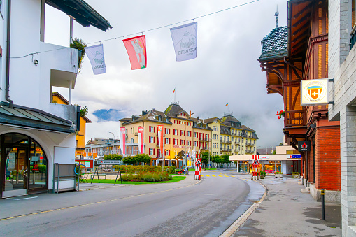 One of the main streets of cafes, hotels and shops through the city center of the village of Engelberg, Switzerland, home to Mount Titlis.
