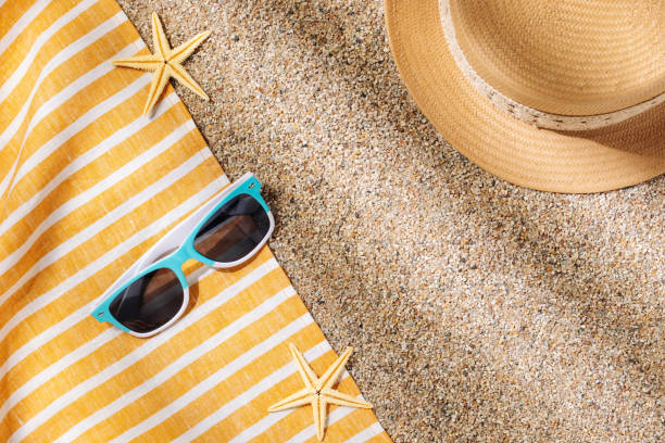 istock Straw hat and sunglasses on the beach sand 1504763491