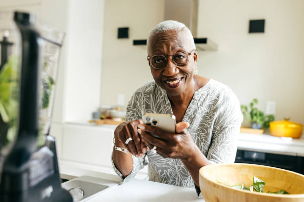 istock Senior women using cellphone for online banking 1504764172