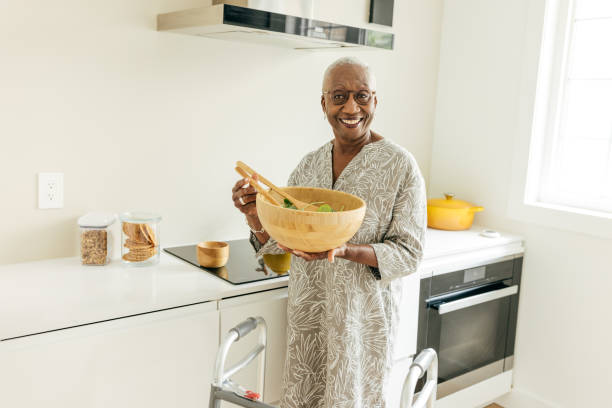 istock Senior women mixing ingredients for salad 1504764699