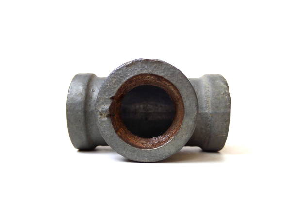 istock Close up of rusty metal pipe fitting isolated on white background. 1504767992