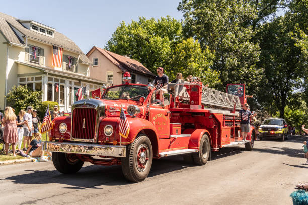 Jersey City, USA - June 30, 2023: firetruck truck Fire Department turning on a crosswalk.