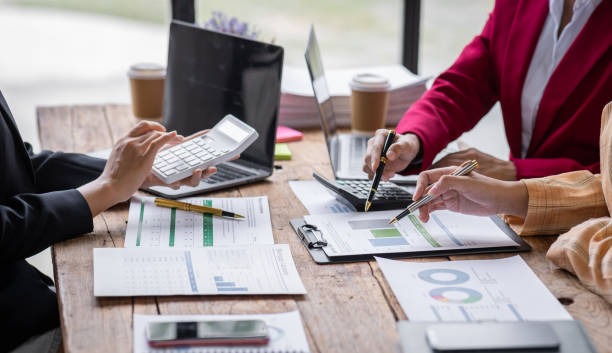 istock Team of Business people working at workplace with tablet and document, doing planning analyzing Tax financial report, business plan investment, finance analysis Economic business discussions. 1504792836