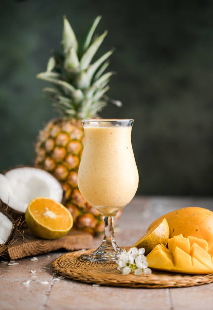 istock Pina colada pineapple cocktail or Lassi on a rustic wooden table 1504841818