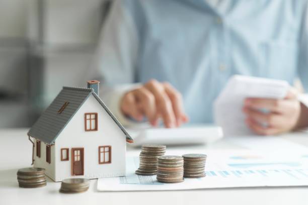 Property Insurance And Tax Money. House Investment Growth stock photo