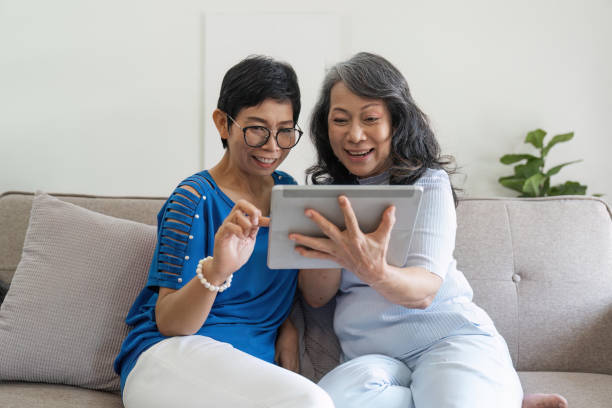 istock Cheerful senior ladies using your tablet to surf the world online 1504930708