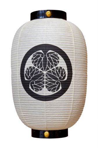Isolated Japanese paper lantern over white background.