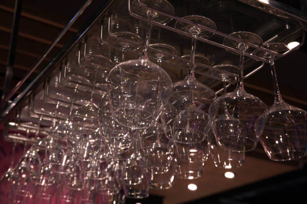 istock Hanging glasses over the bar, many clean glasses 1504950931
