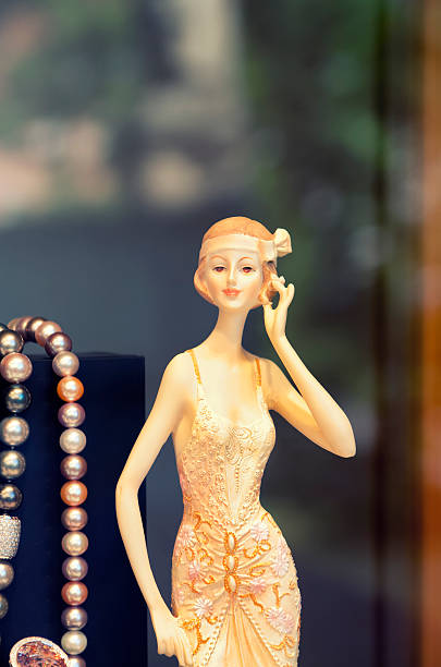 Vintage mannequin in store window, toned image.