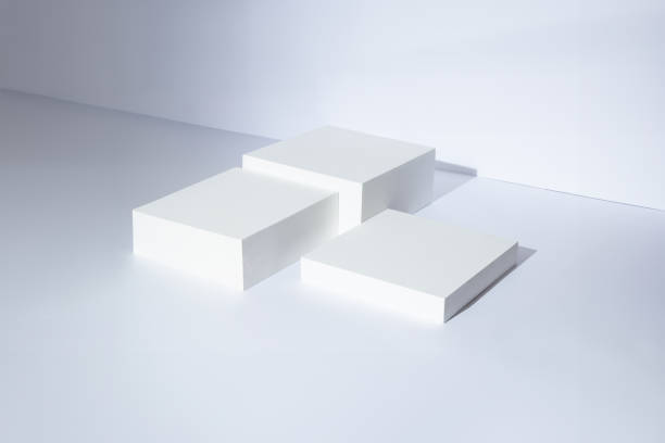 istock Abstract Modern and minimal style, white cube step podium with white wall scene background for product display presentation. 1504958515