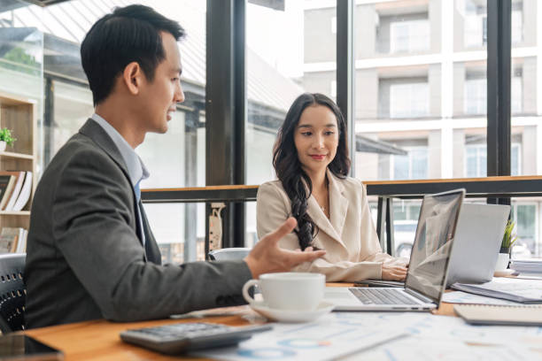 istock Teamwork meeting, laptop and business people in office workplace. Collaboration, technology and workers, business or employees with screen planning sales, research or financial strategy in company 1504977435