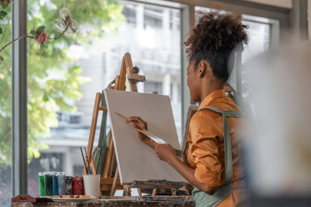 istock artist with pencil sketch picture at art studio 1504977546