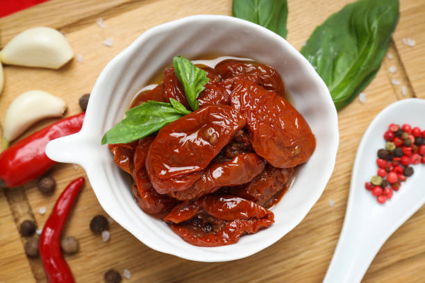 istock Concept of tasty food - sun-dried tomato, top view 1504977607
