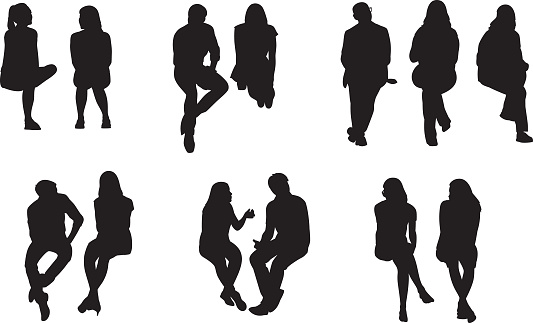 Vector silhouettes of a group of people sitting.