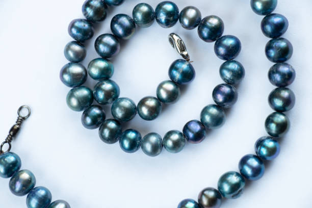 istock pearl female beads on an isolated background close-up 1504992329