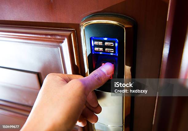 Lady Using Thumbprint Technology To Open A Door Stock Photo - Download Image Now - Accessibility, Adult, Adults Only