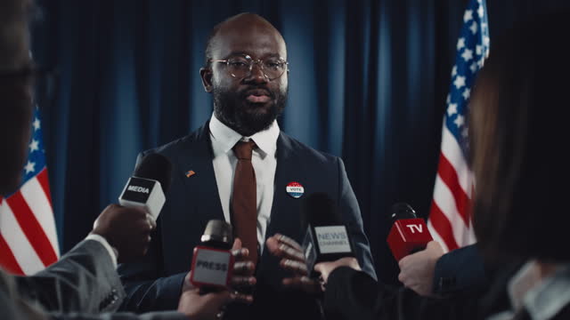 Black Male Candidate Talking to Media during Election Campaign