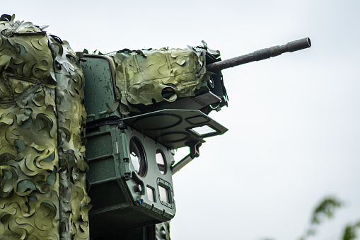 Anti-drone laser system trialed on a Stryker combat military vehicle with a machine gun aimed at the sky in Ukraine during the counteroffensive, NATO response force