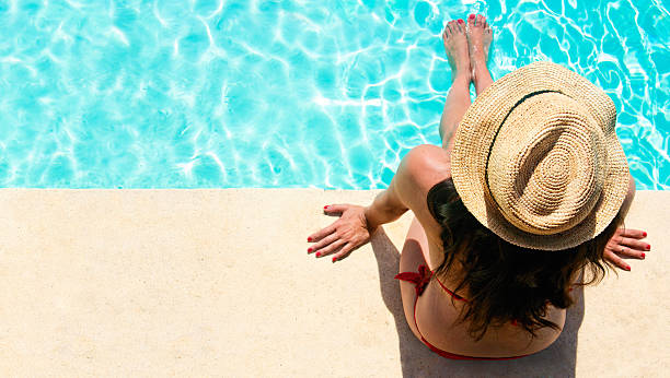 istock Woman sitting in a swimming pool 150504453