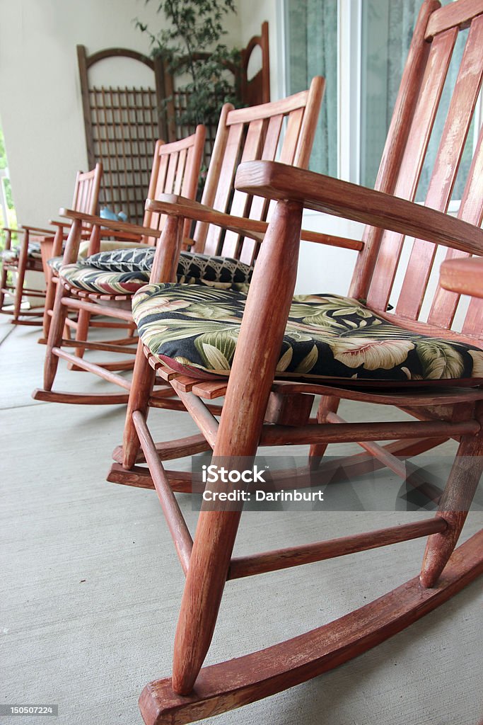 rocking chairs on the stoop wooden rocking chairs No People Stock Photo