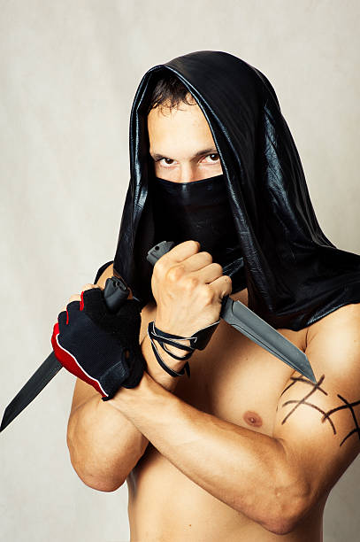 istock Man assassin with sexy torso in mask 150508549