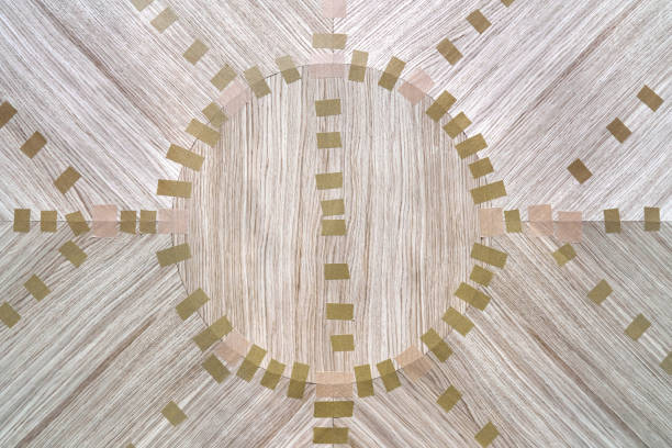 Jointed veneer with tape into canvas for table top of dining table with geometric pattern on workbench in workshop upper close view